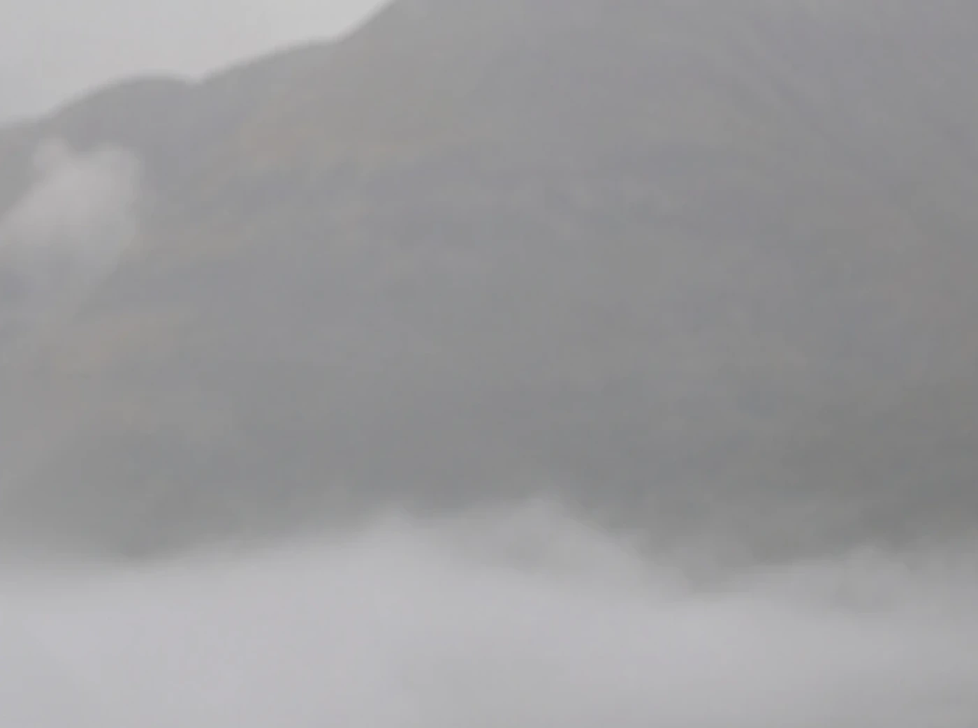 Mist moving across a quiet mountain landscape