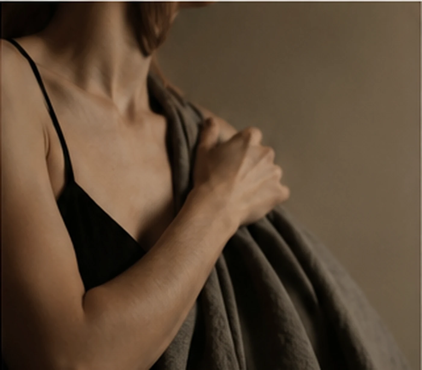 A woman holding soft charcoal linen